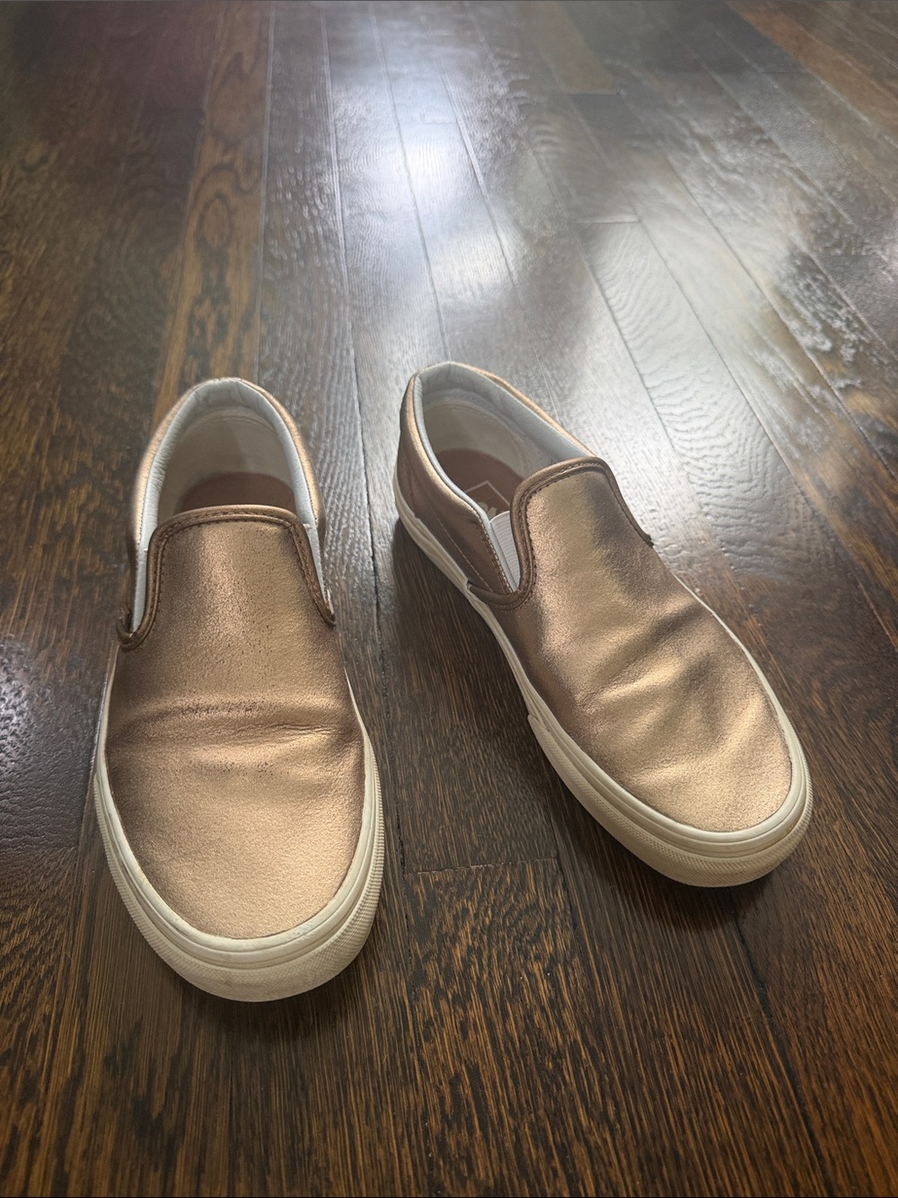 Metallic bronze slip on Vans